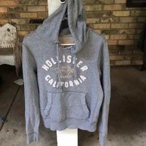 Grey Hollister hooded sweatshirt.